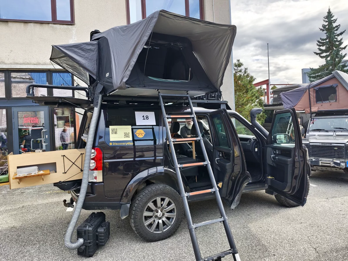Land Rover Discovery #18 with a roof tent and a ladder