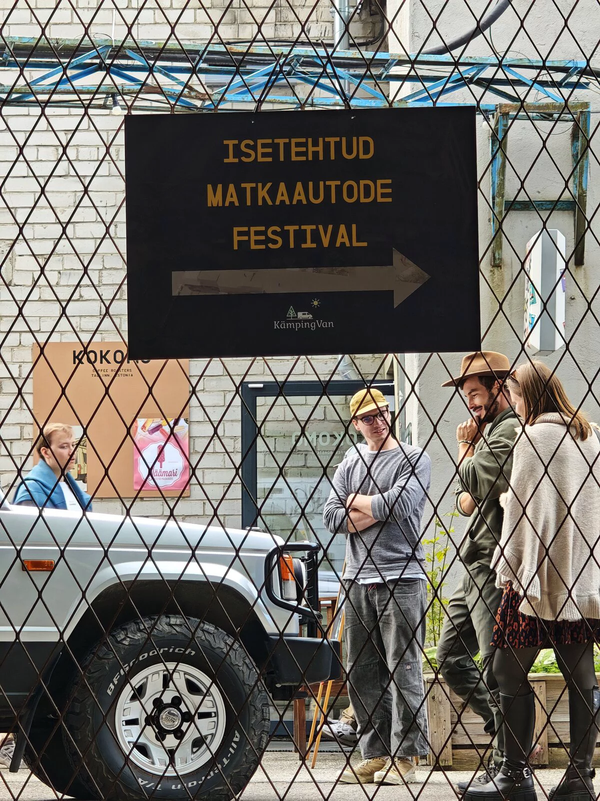 Isetehtud matkaautode festival sign on the fence of the quarter