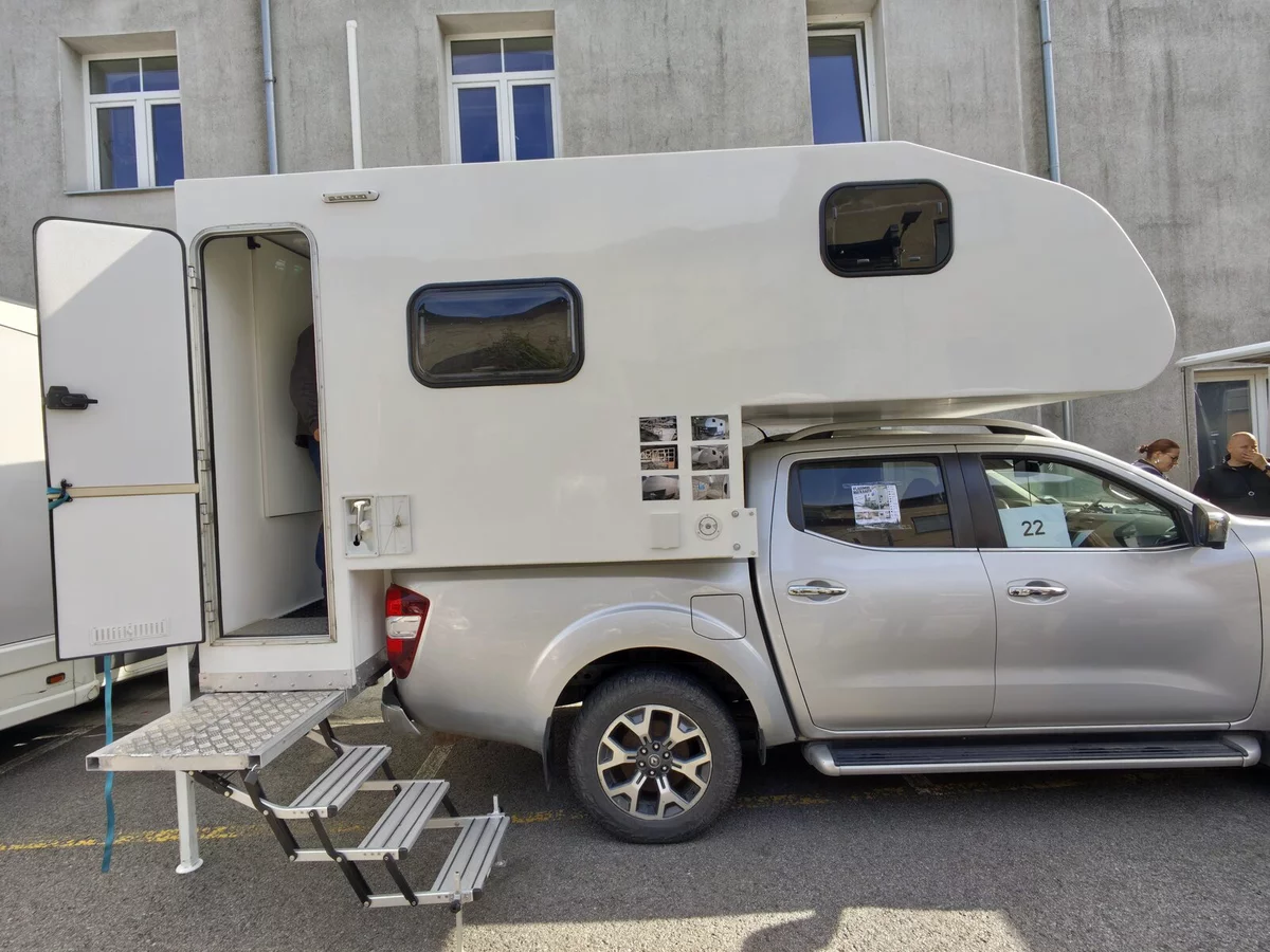 Pickup with a homemade camper body, number 22