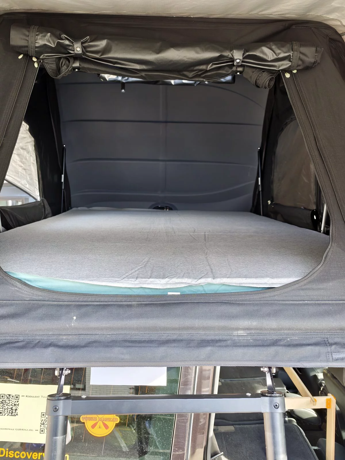 Opened roof tent on a Land Rover Discovery