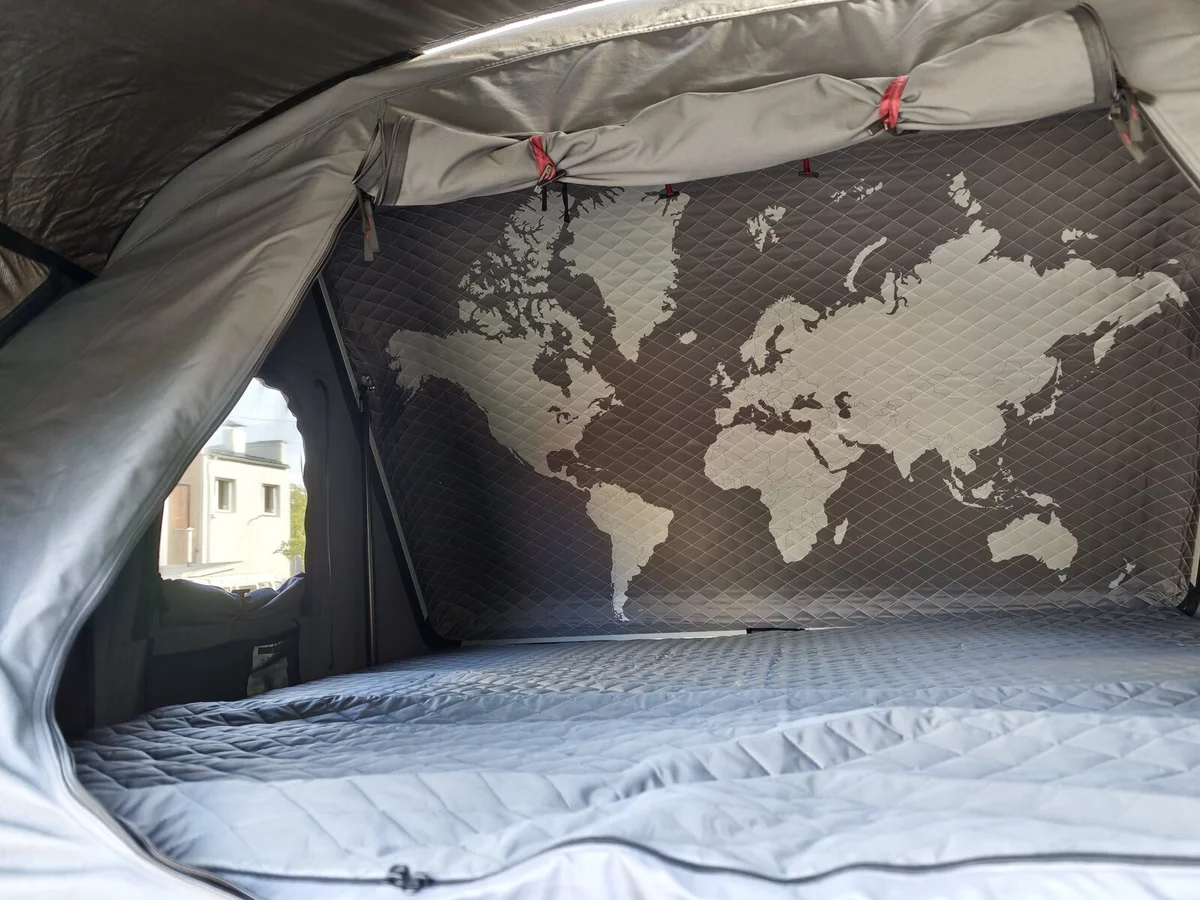Inside the roof tent: a world map on the wall