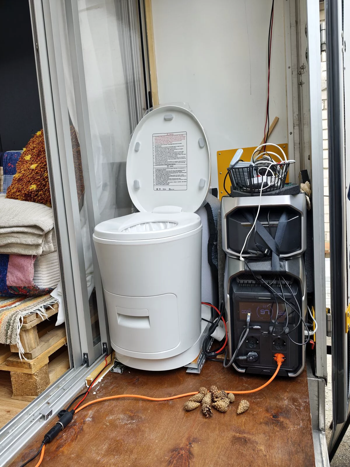 Camping toilet and portable power stations inside a van