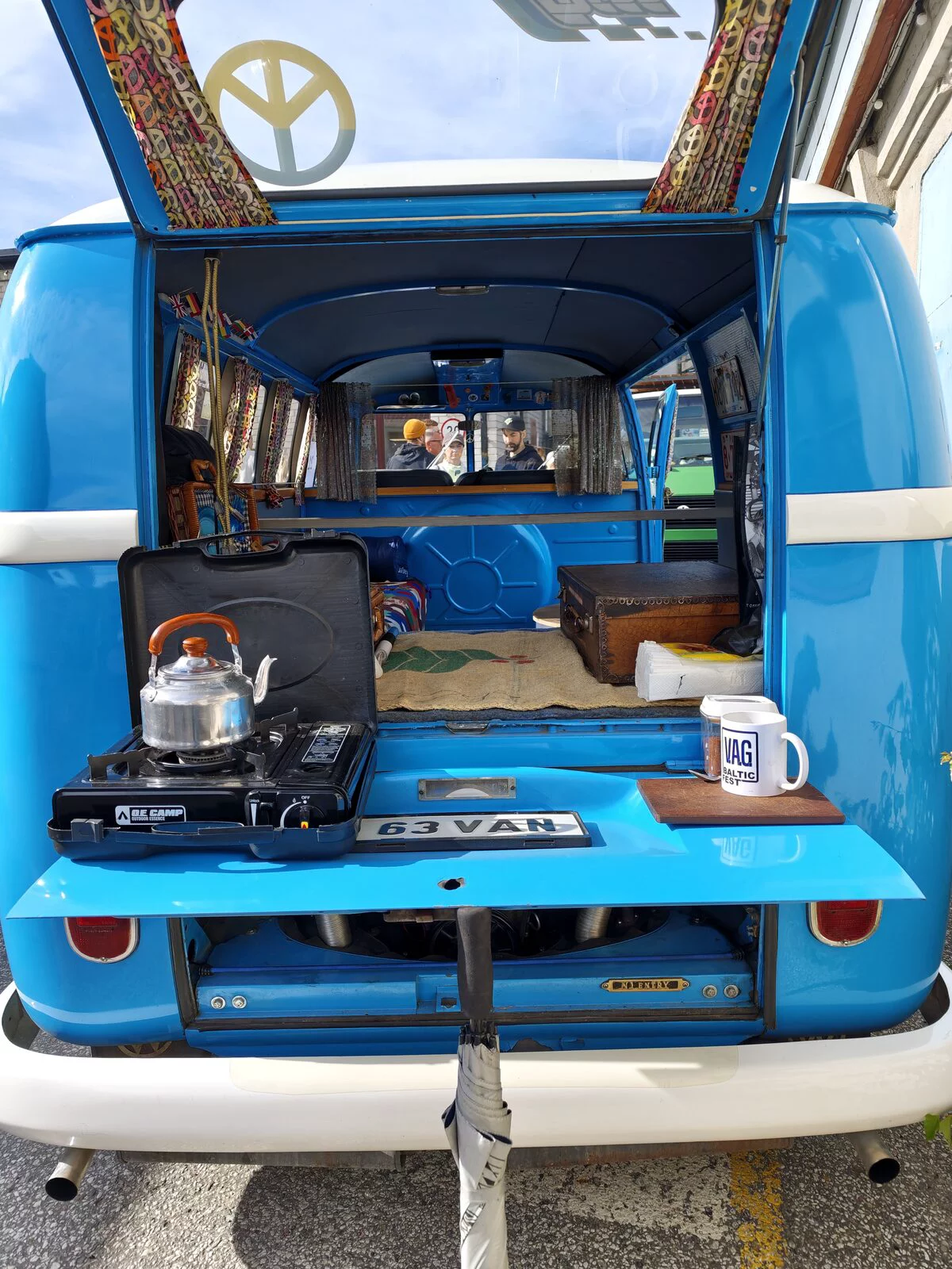 Rear of the VW T1: gas stove and kettle on the folded-down engine lid